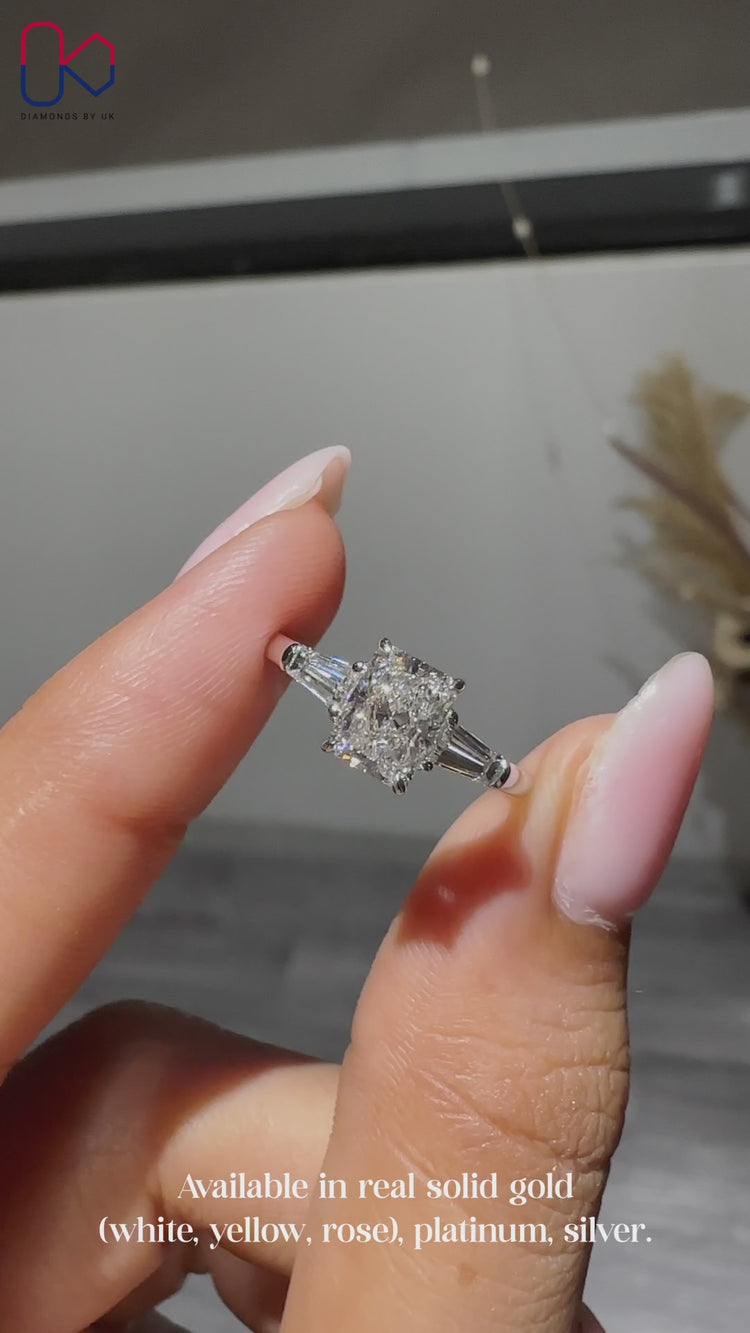 IGI Certified pear ring with round side diamonds.