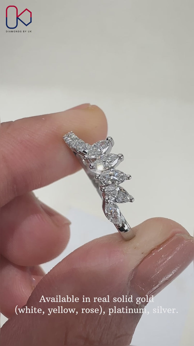 Elegant marquise diamond wedding band with sparkling diamonds set in a tiara style.
