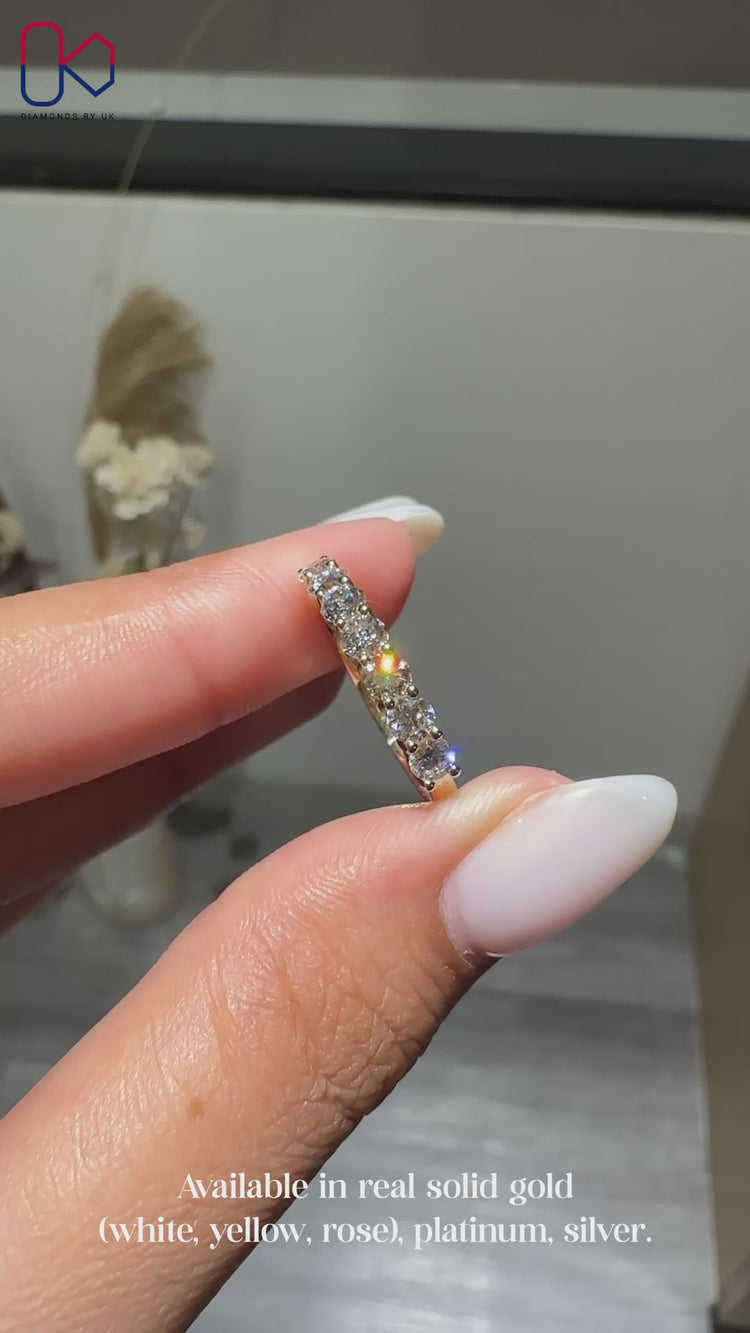 Round diamond band in yellow gold diamond band.
