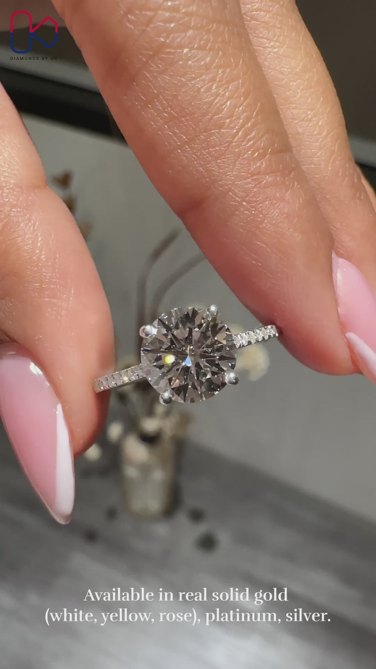 Round cut diamond ring in a classic design.
