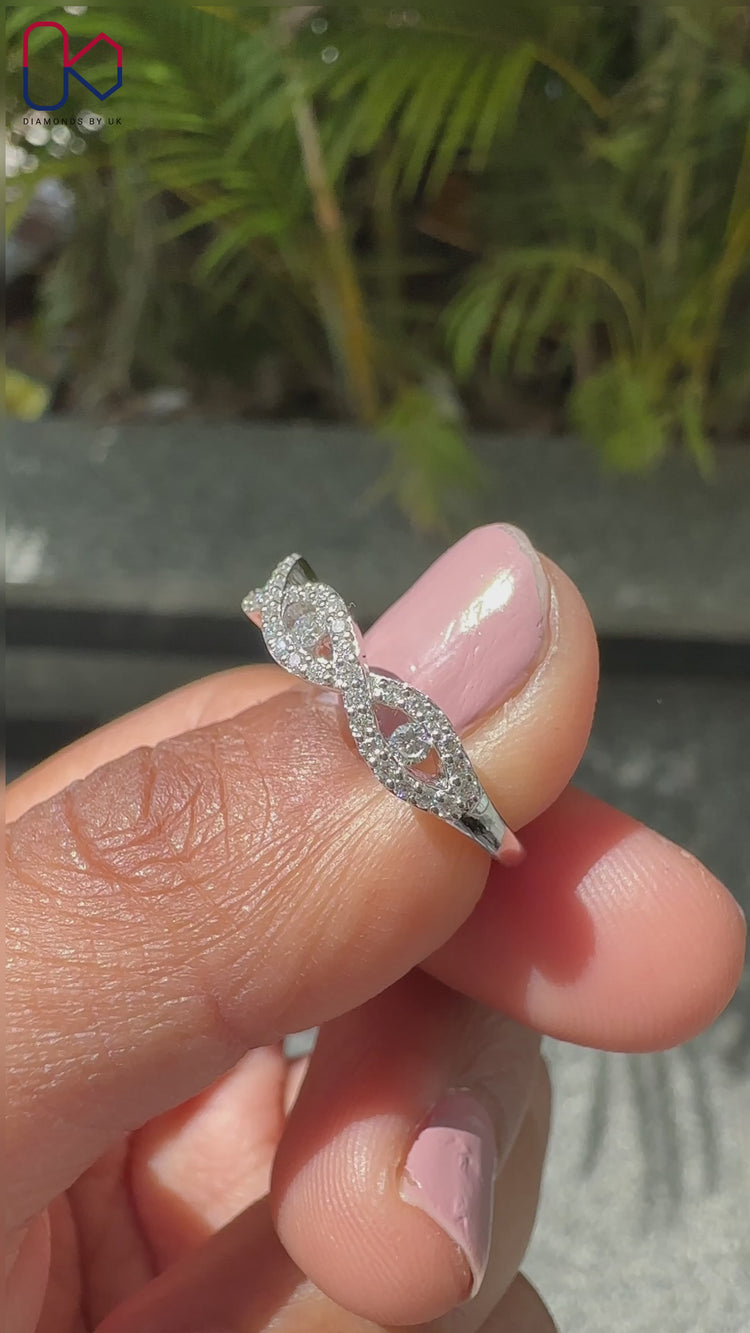 Round diamond band with infinity and twisted design.
