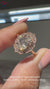 Oval Halo Diamond Ring with Milgrain Detail.
