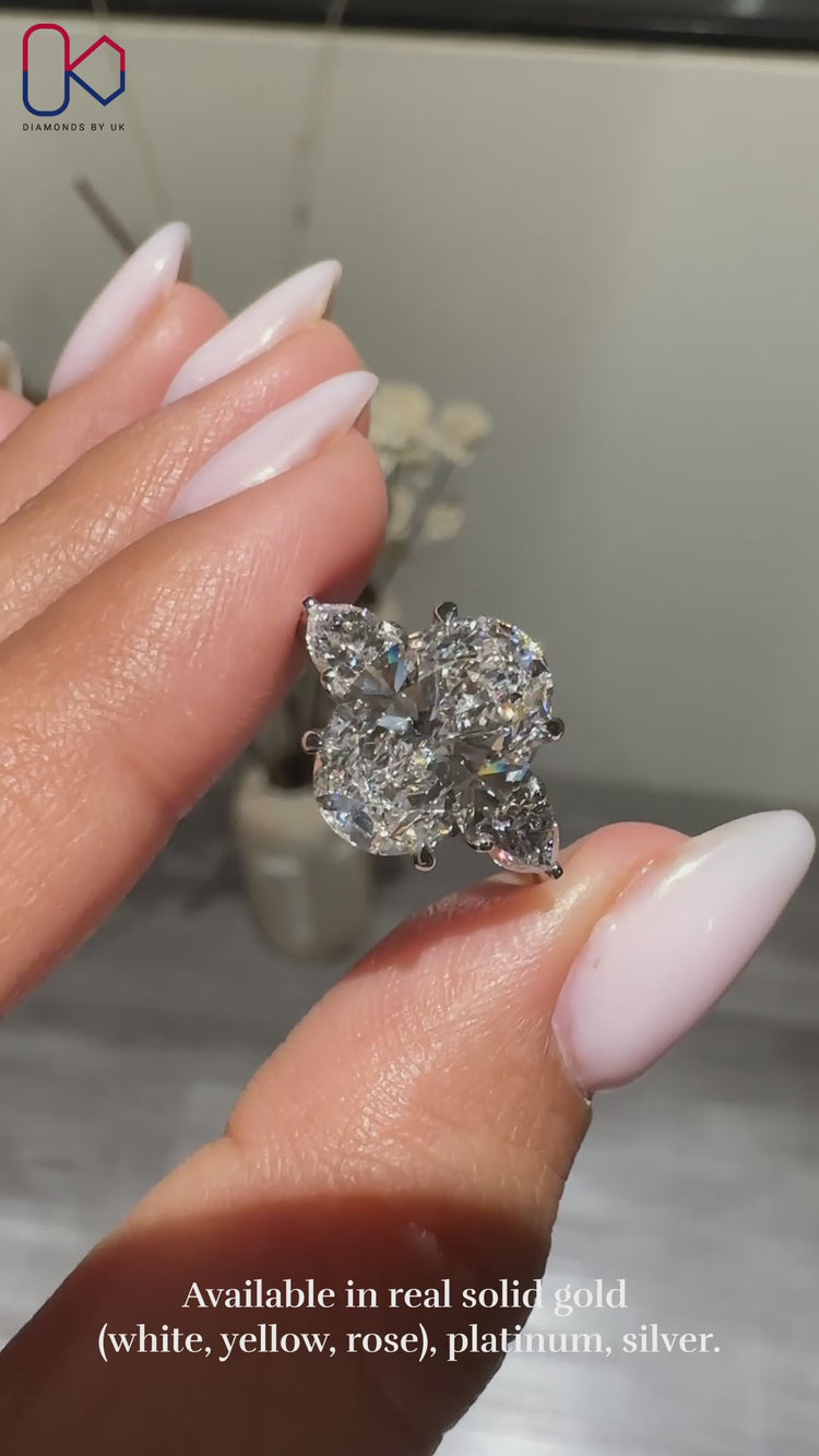 Oval cut diamond ring with a modern design.
