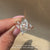 Nature inspired marquise ring with cluster side stones.
