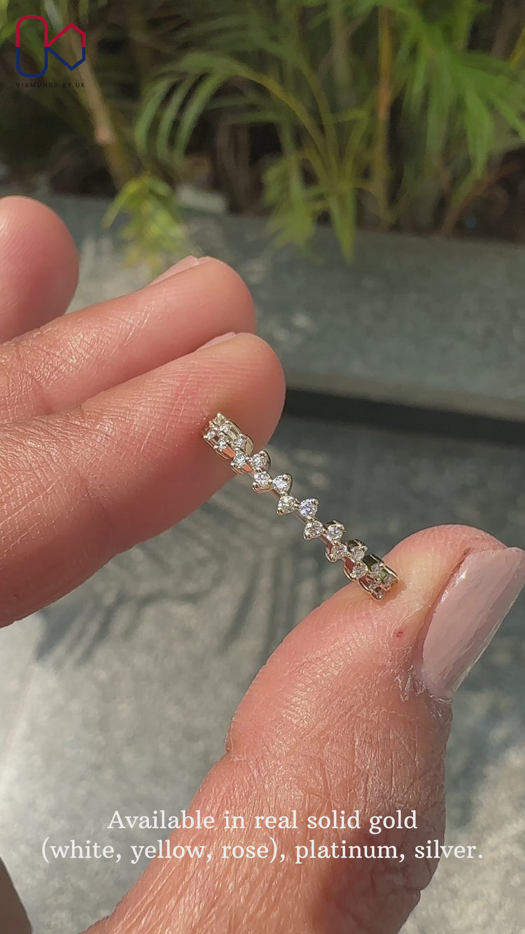 Zig zag diamond wedding band made with prong set round lab diamonds.