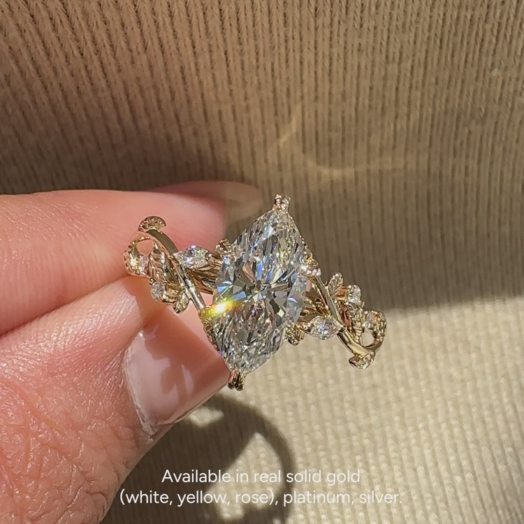 IGI certified lab grown marquise ring with side stones.

