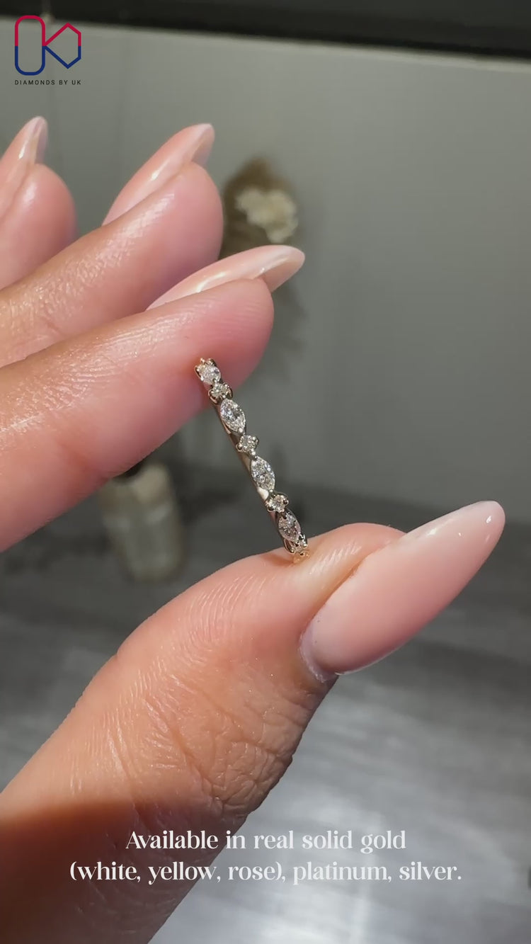 Half eternity wedding band with marquise and round diamonds
