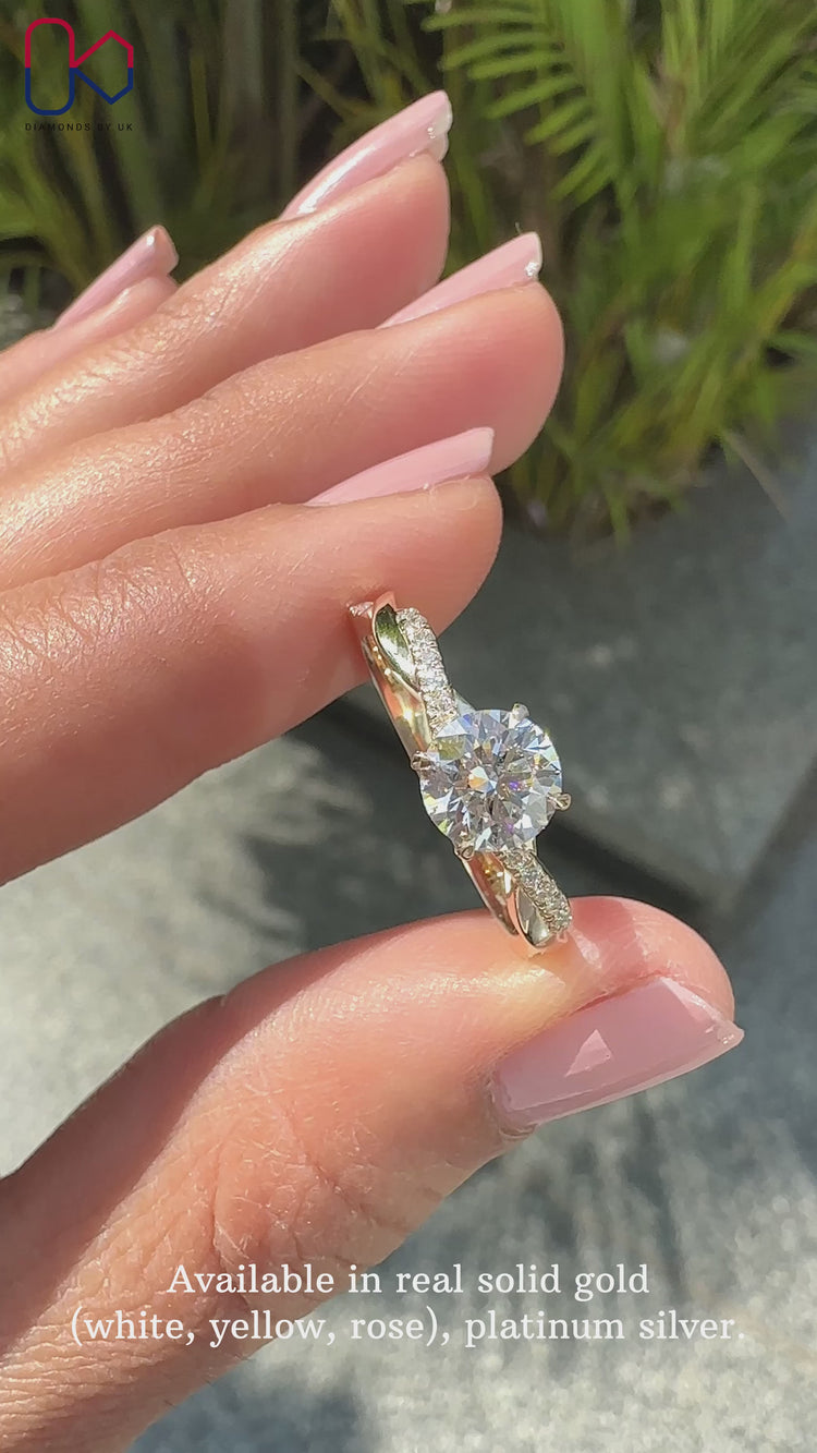 4 claw prong setting on white gold engagement ring.

