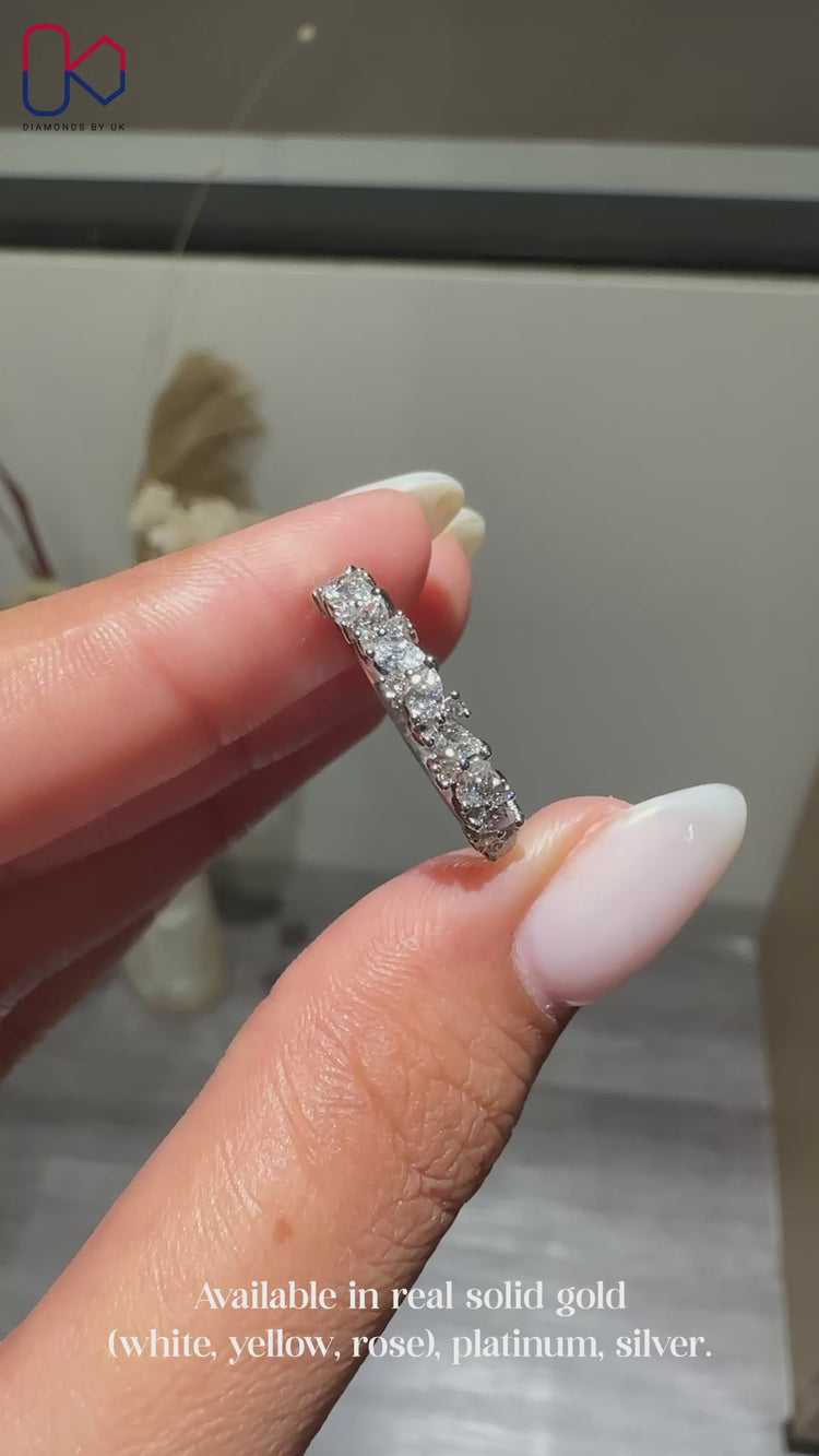 Pear diamond wedding band crafted in white gold.
