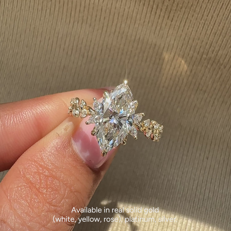 IGI certified lab grown marquise ring with side stones.
