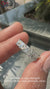 7 stone wedding band with radiant cut diamonds in a claw prong setting.
