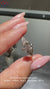 Round diamond ring with pear side stones set in a beautiful design for added elegance.
