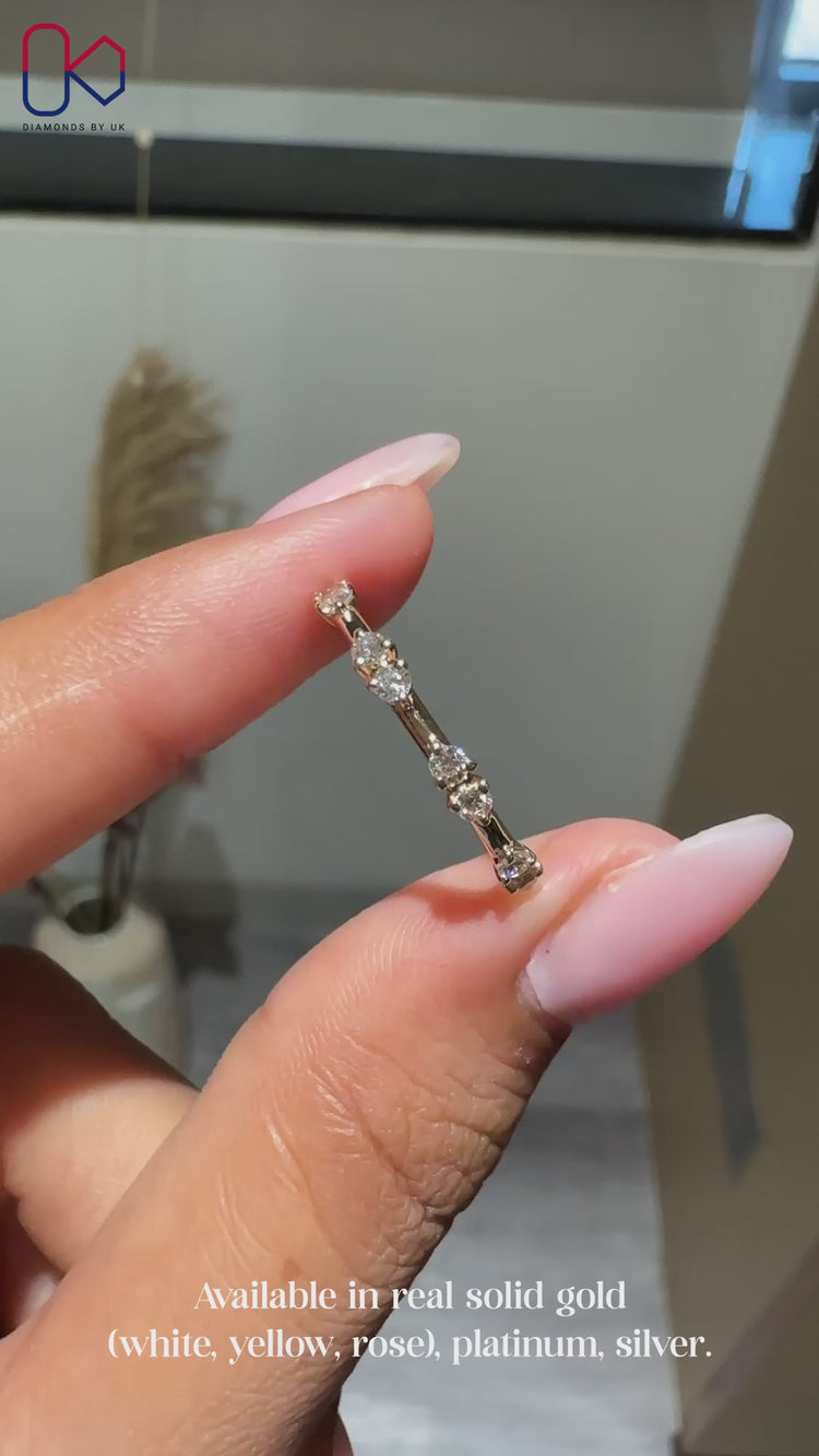 Half eternity wedding band with round cut diamonds.
