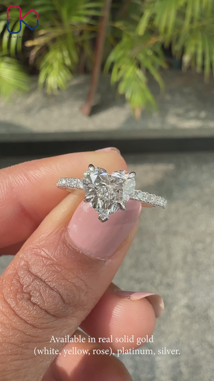 White Gold Engagement Ring with cathedral setting design.
