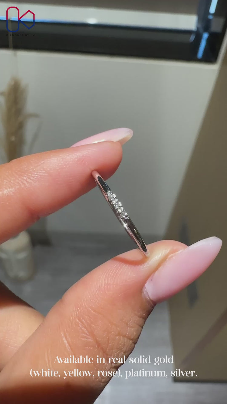 3 stone wedding band with round diamonds.
