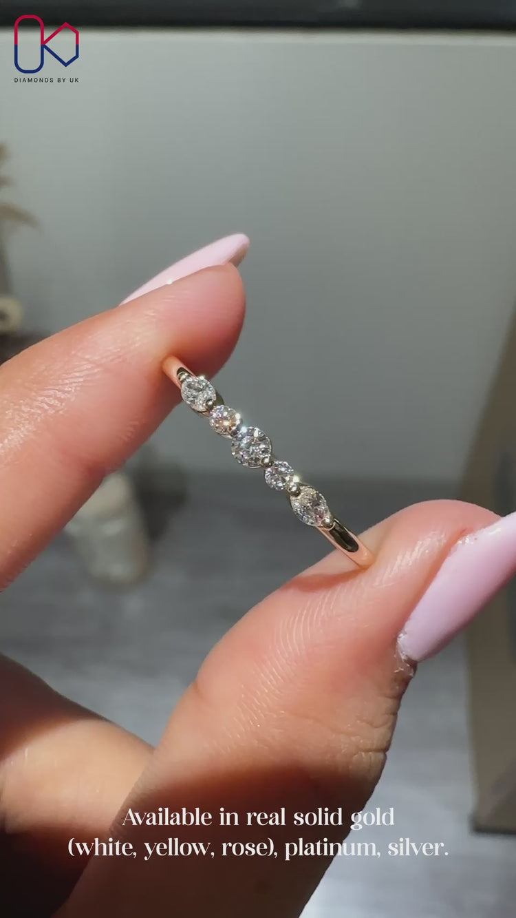 5 stone wedding band with oval and round diamonds.
