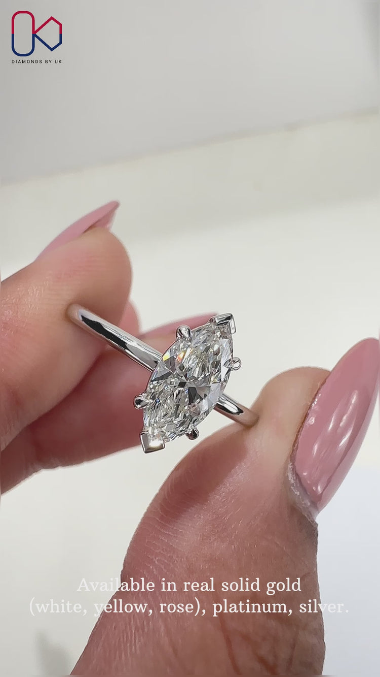Solitaire diamond ring featuring a Marquise diamond ring in a secure prong setting ring.
