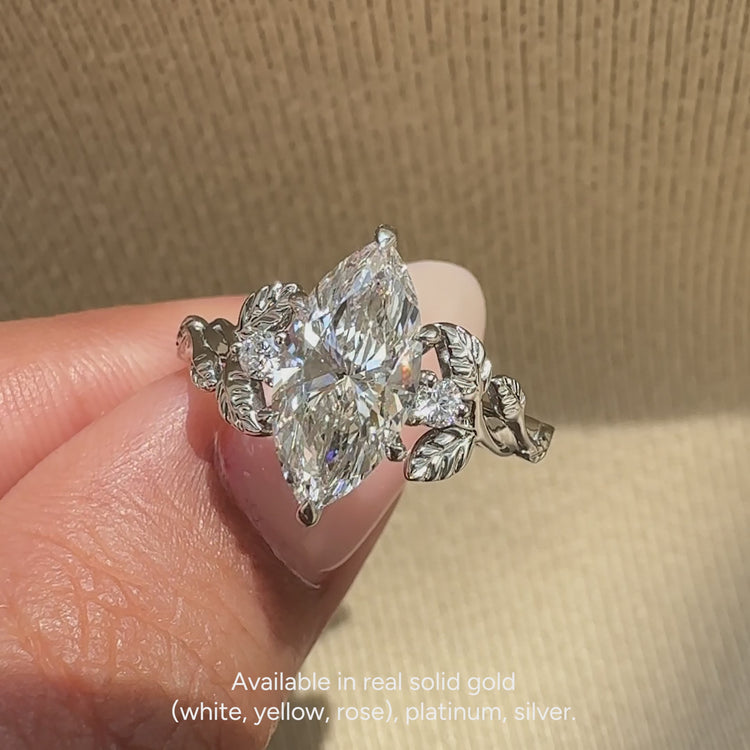 IGI certified lab grown marquise ring with side stones.

