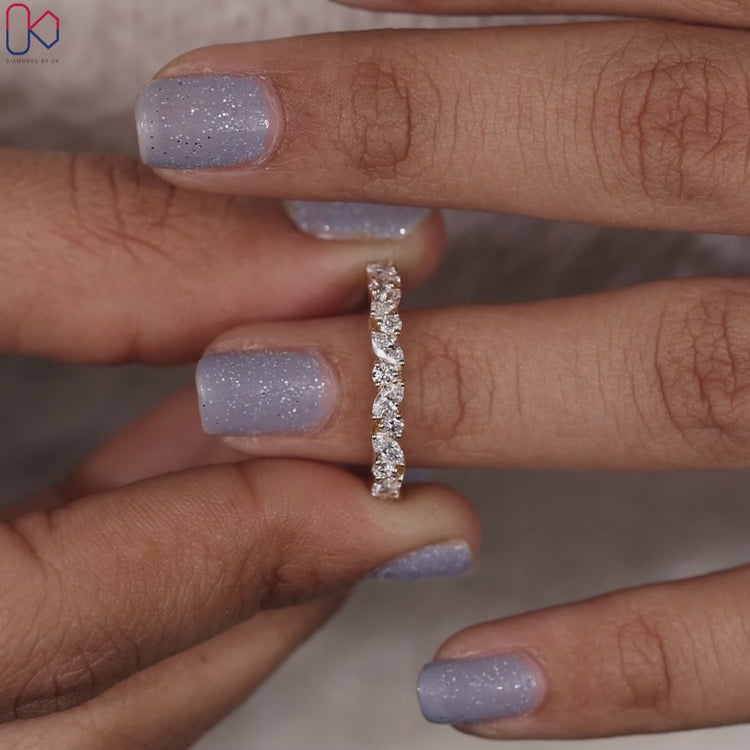 Prong set eternity band with delicate handmade marquise and round diamonds.
