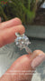 Twisted band engagement ring featuring a brilliant round diamond engagement ring.
