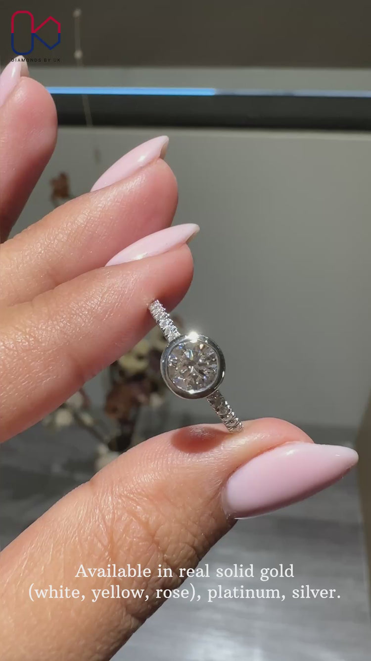 Pave ring with round cut diamonds, white gold setting.
