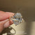 IGI certified oval cut ring with six claw prong setting.  
