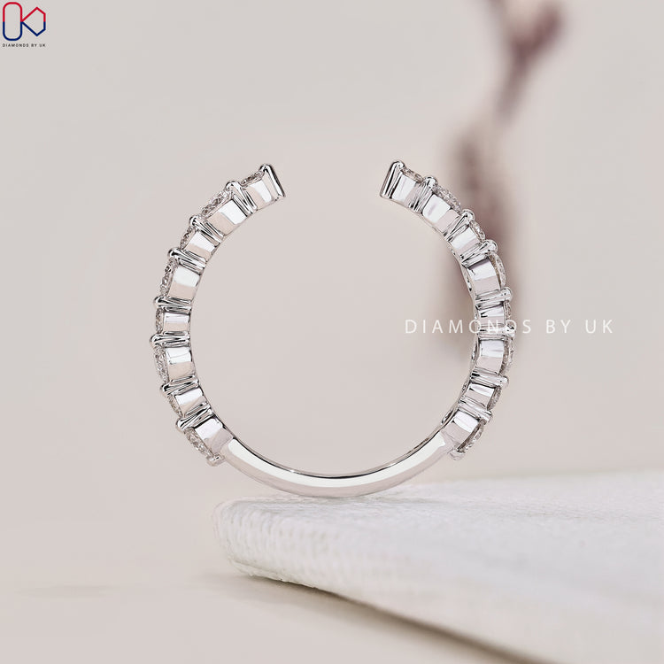 A prong setting wedding band designed with exquisite detail in white gold.