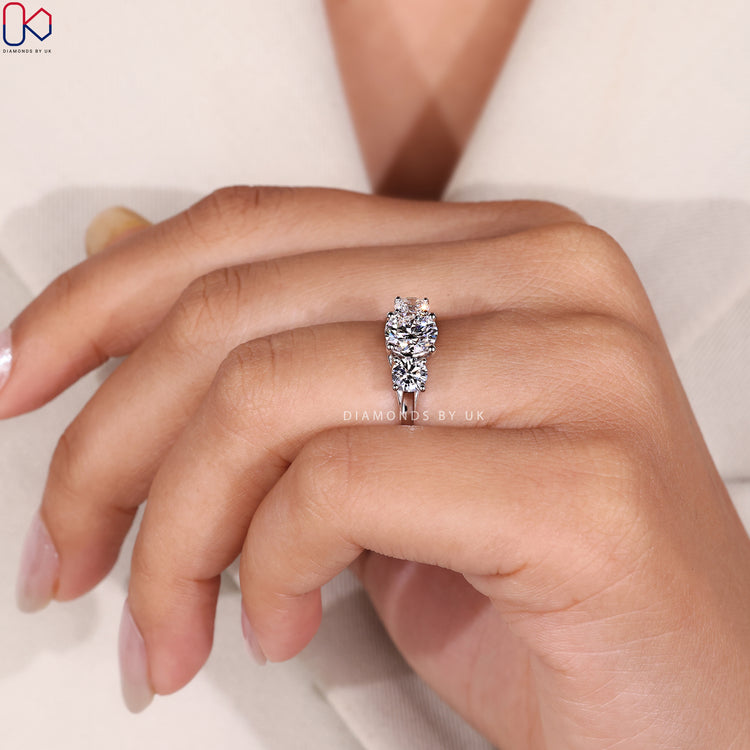 Three stone diamond ring with trellis setting.
