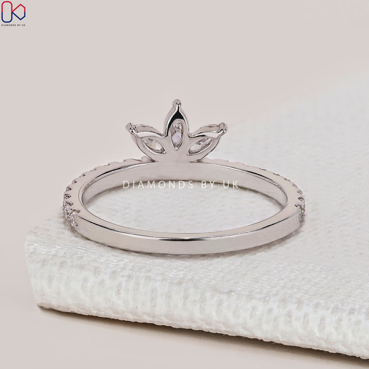 Handmade marquise and round diamond band with prong setting.
