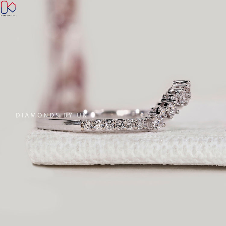 Handmade round diamond band with prong setting.