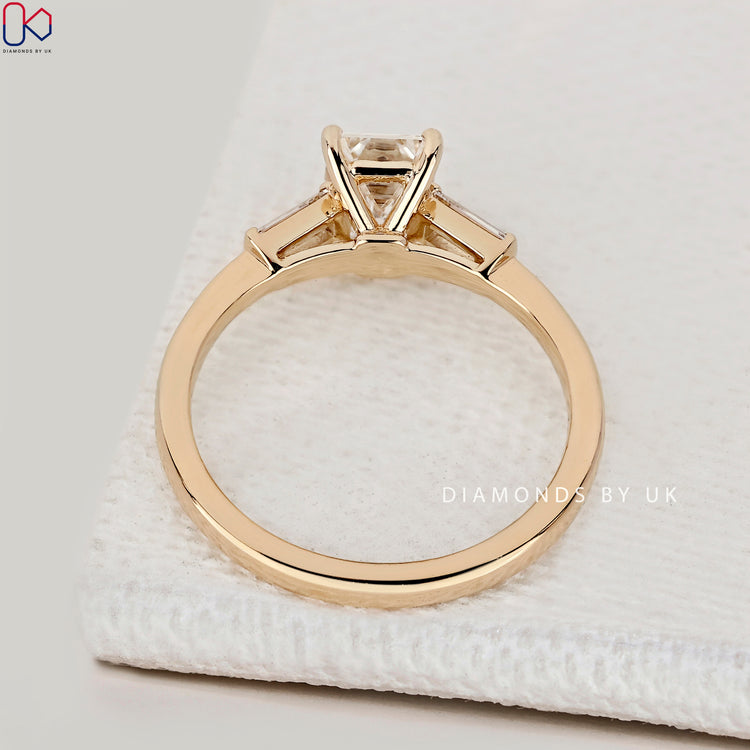 Handmade emerald cut ring with prong setting.