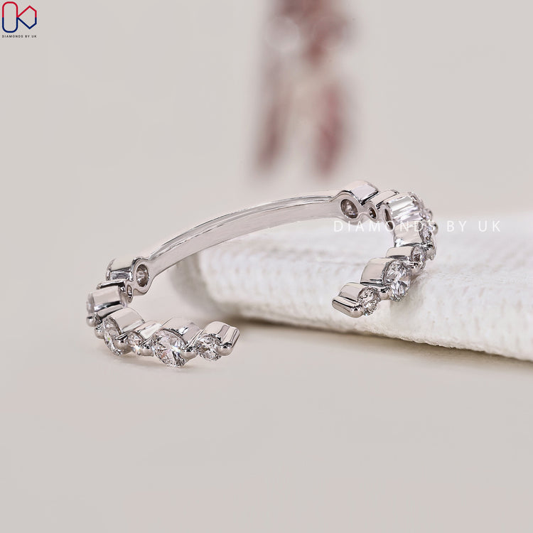 A stylish open gap wedding band, handmade for a modern and unique look.
