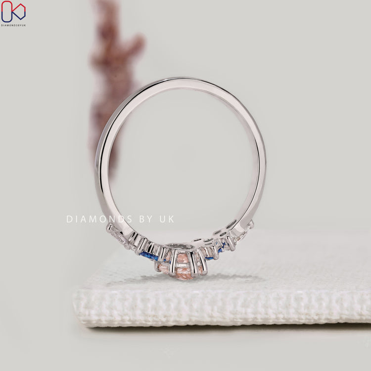 Marquise engagement ring with cluster setting