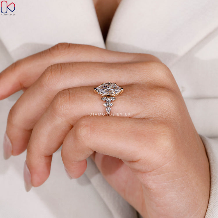 Lab grown marquise ring with round side diamonds.
