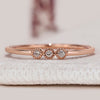 Round diamond wedding band with three stone style.
