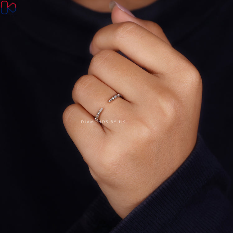 Open gap diamond wedding band with round diamonds.