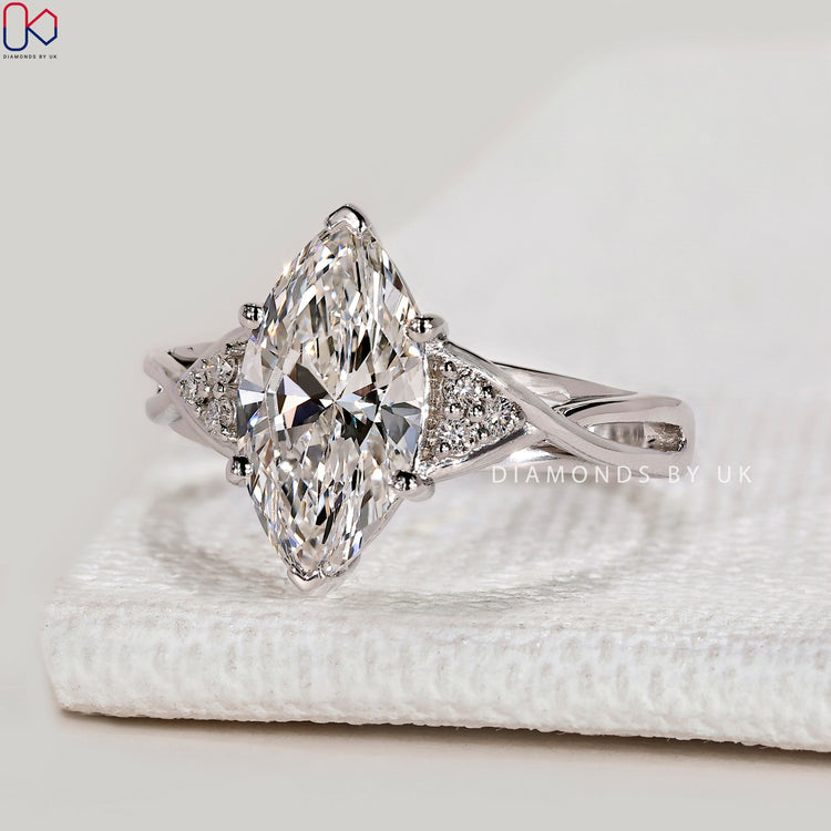 Marquise lab grown diamond ring with cathedral.
