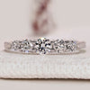 Half eternity diamond wedding band with round diamonds.