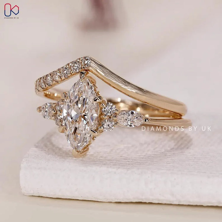 Marquise ring with round and marquise side stones.