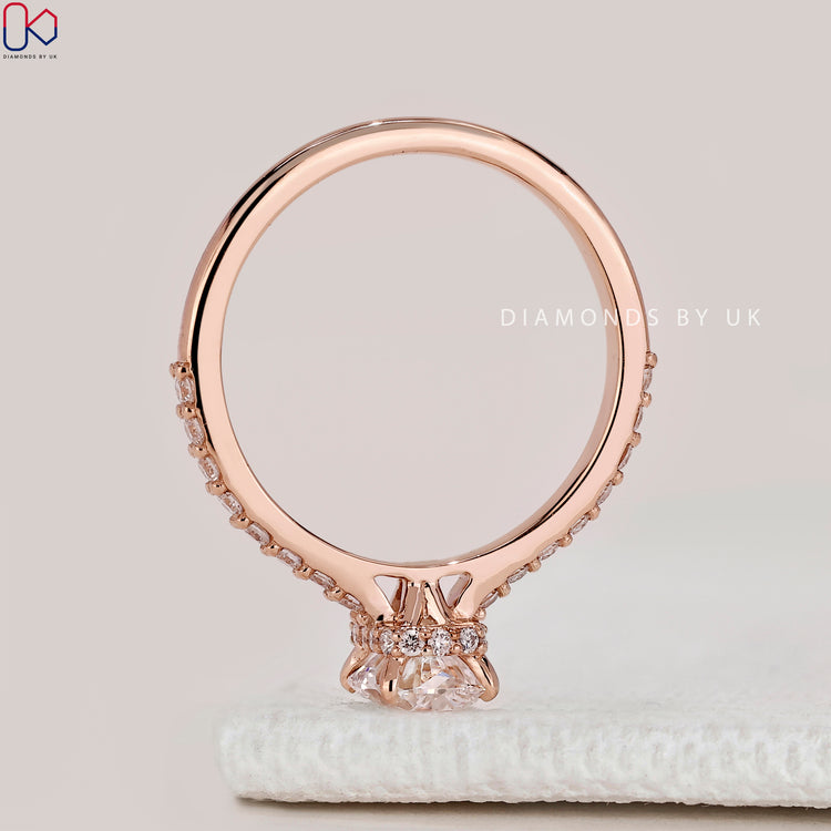 Cushion cut ring with cathedral setting style.