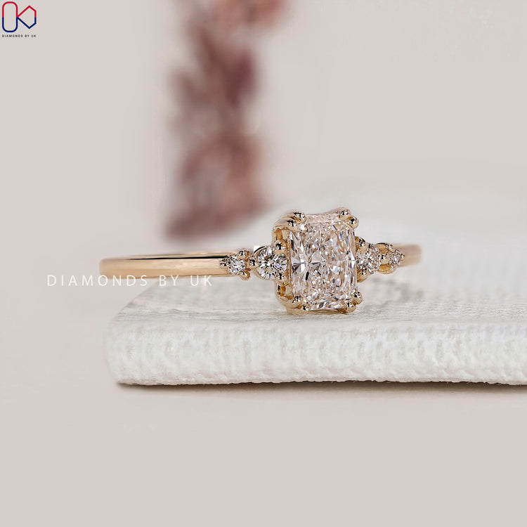 Radiant cut lab grown diamond five stone ring.