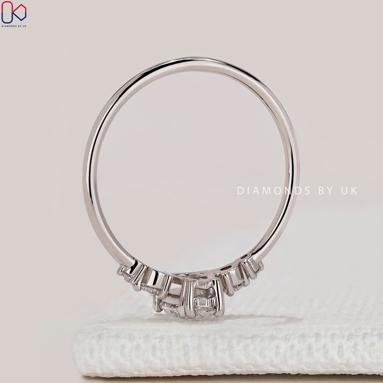 Pear cut lab grown diamond five stone ring.