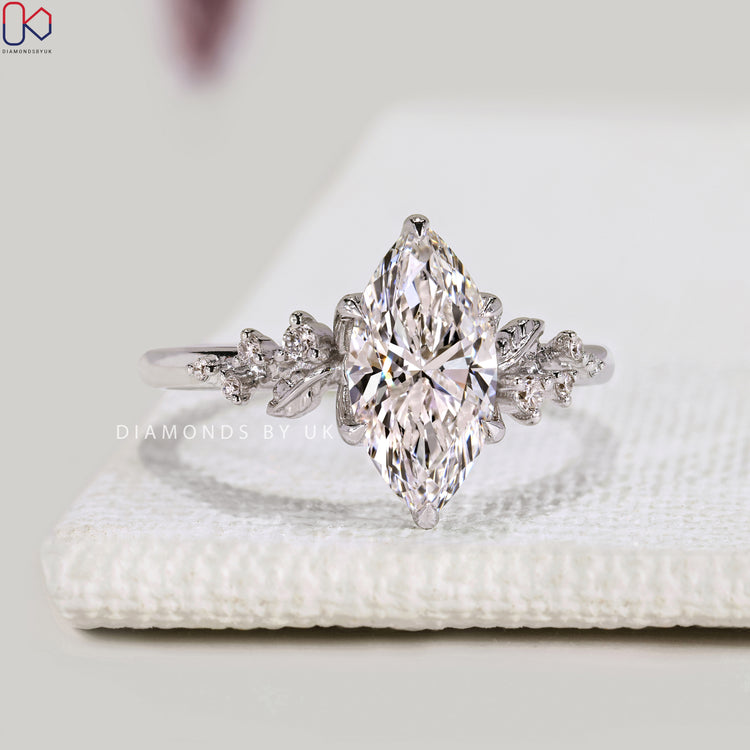Marquise diamond ring with nature inspired details.
