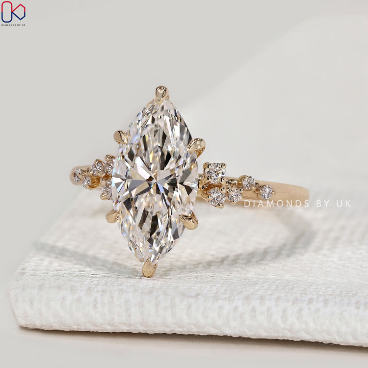 Handmade marquise ring with six claw prongs.