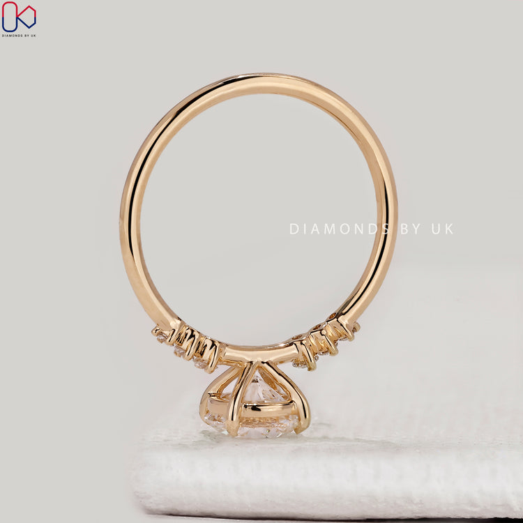 Seven stone round cut ring with side diamonds.