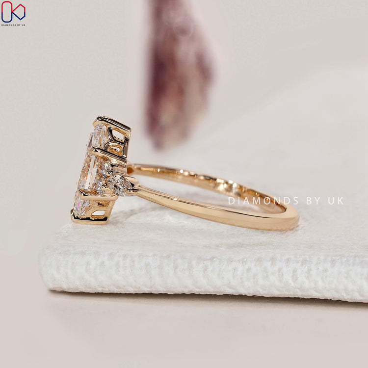Marquise cut lab grown diamond ring with side stones