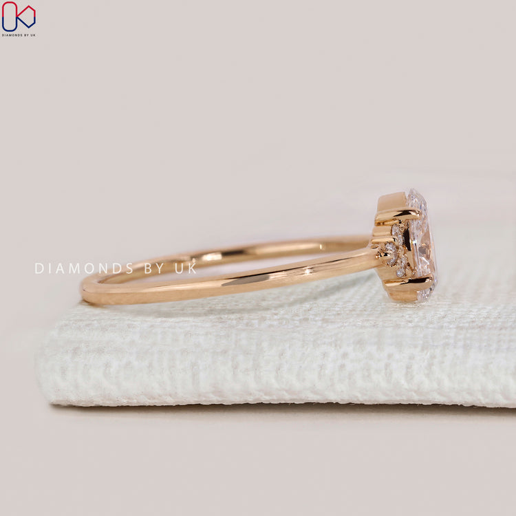 Handmade oval cut ring with muse setting style.