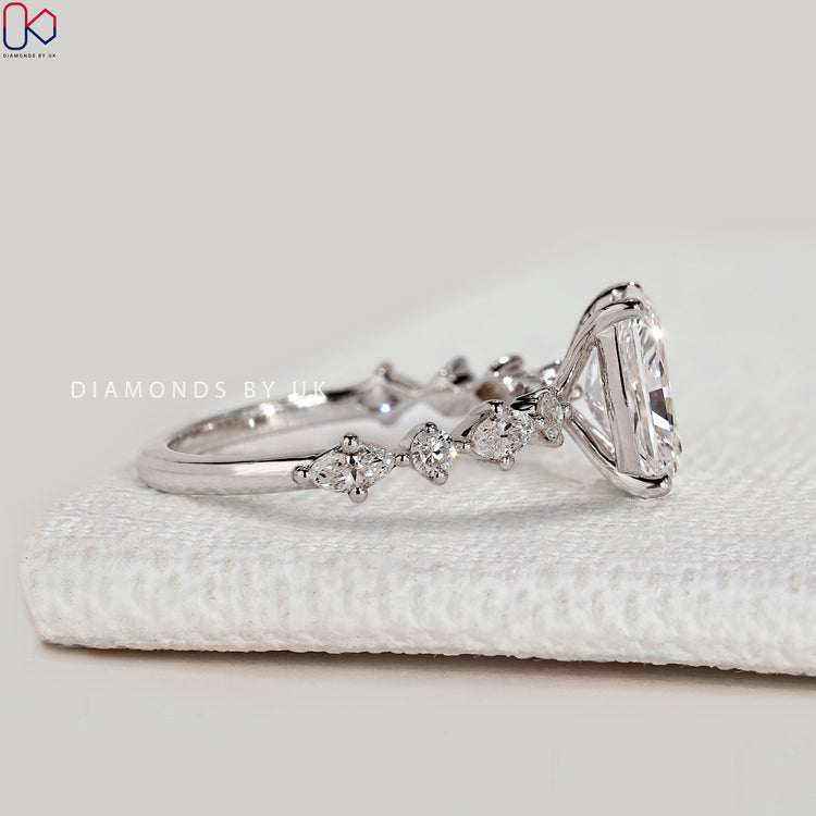 Handmade radiant ring with four prong pavé style.