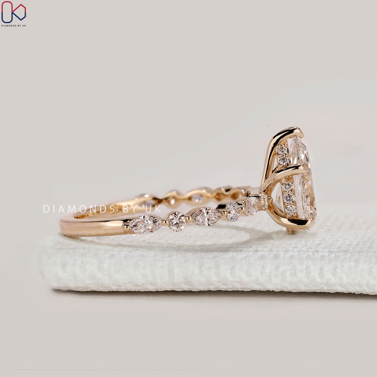 Handmade pear ring with five claw prong setting.