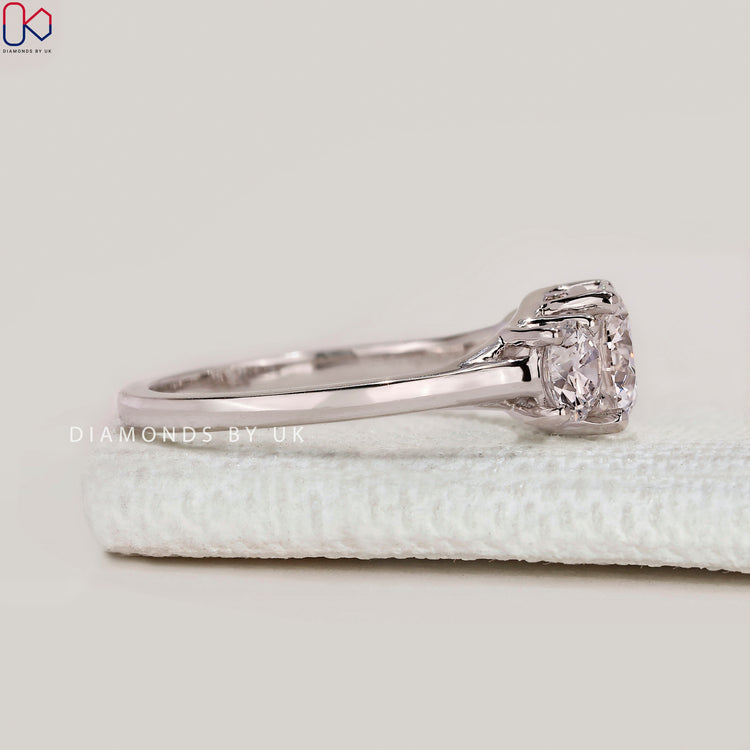 Handmade three stone ring with four prong setting.
